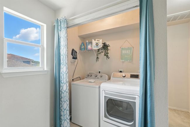 Washroom featuring independent washer and dryer and baseboards | Image 24