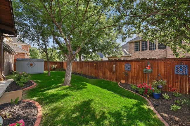 View of yard featuring an outdoor structure and a storage shed | Image 34
