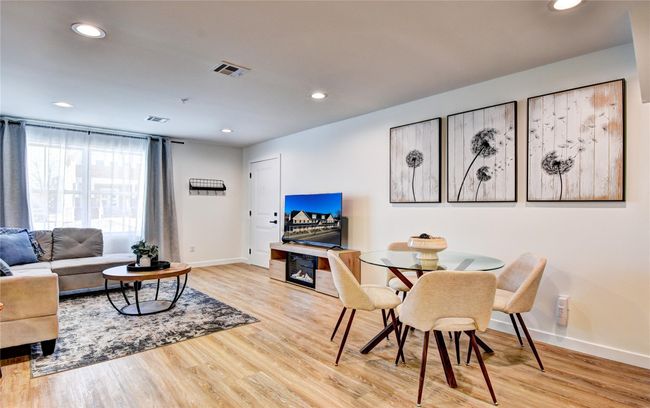 Living room with recessed lighting, wood finished floors, visible vents, and baseboards | Image 6