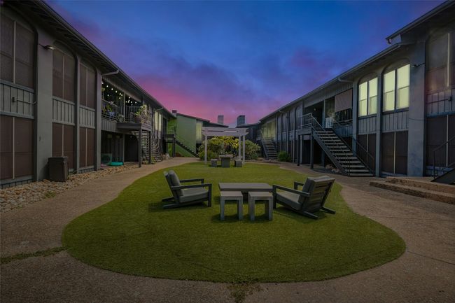 View of community featuring stairs and a yard | Image 18