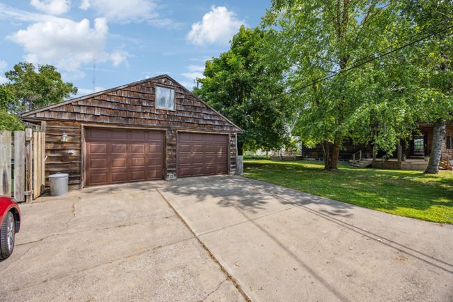 Oversized two car detached garage. Concrete Driveway. | Image 24