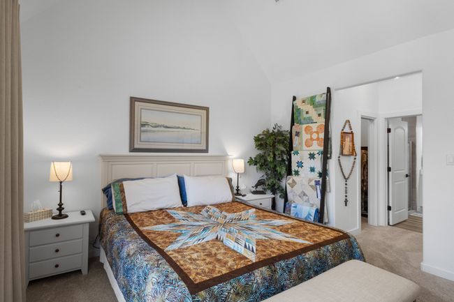 Bedroom featuring carpet flooring and lofted ceiling | Image 23