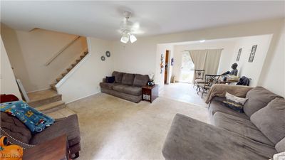 Carpeted living room with ceiling fan | Image 3