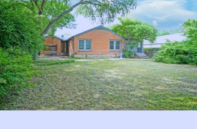 Back of property featuring a lawn and brick siding | Image 12