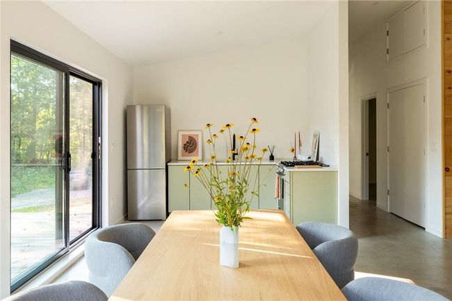 Dining area with concrete flooring | Image 4