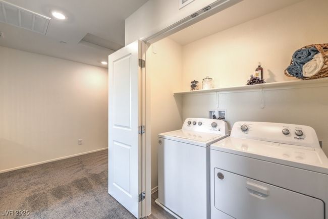 Laundry room featuring carpet flooring, visible vents, washer and clothes dryer, recessed lighting, and laundry area | Image 33