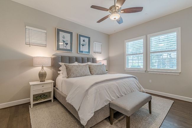 Bedroom featuring baseboards, wood finished floors, and a ceiling fan | Image 26