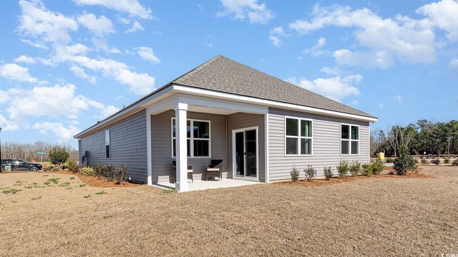 Back of property featuring a lawn, a patio area, and roof with​​‌​​​​‌​​‌‌​‌‌​​​‌‌​​‌‌​‌​​​​​‌ shingles | Image 22