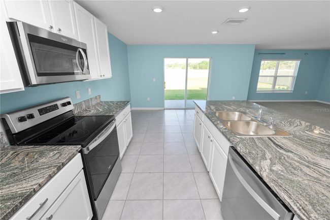 8009 Sail Clover Ln, House other with 4 bedrooms, 3 bathrooms and null parking in ZEPHYRHILLS FL | Image 6