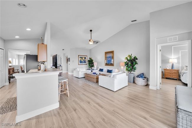 Kitchen, Great room style Living room with Volume ceiling, Laminate Wood flooring, Master Bedroom | Image 8