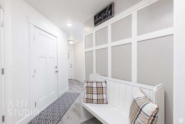 Mudroom with light wood-style flooring | Image 8