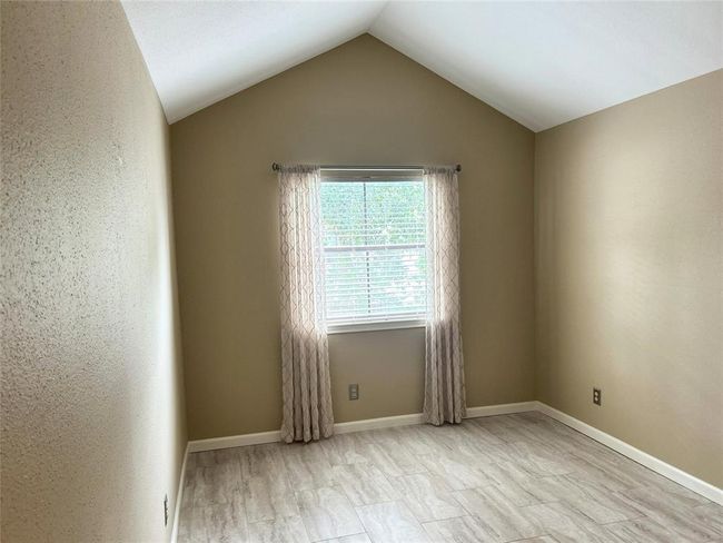 There are two bedrooms upstairs, both connected to bathrooms. This bedroom shares a bathroom with the hall. | Image 31