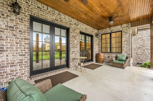 Rest and Relax on your covered porch after a long day at work. Offers beautiful tongue and groove ceiling and lots of space for outdoor entertaining. | Image 9