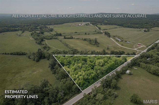 Aerial view of sparsely populated area featuring property boundaries highlighted | Image 43