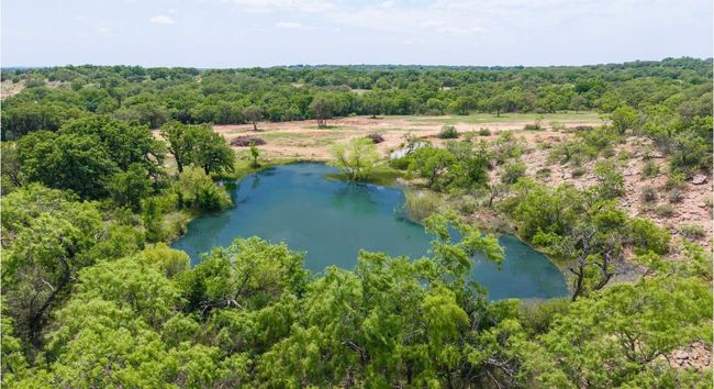 Birds eye view of property featuring a water view and a forest view | Image 33