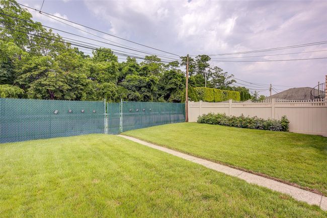 View of fenced backyard | Image 46
