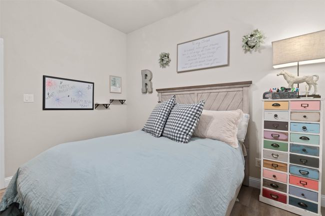 Bedroom featuring wood finished floors | Image 13