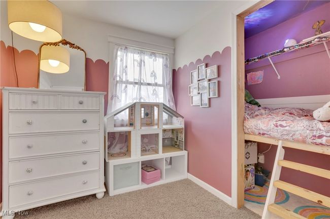 Carpeted bedroom with baseboards | Image 24