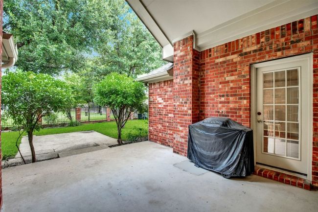 View of patio featuring a grill | Image 32