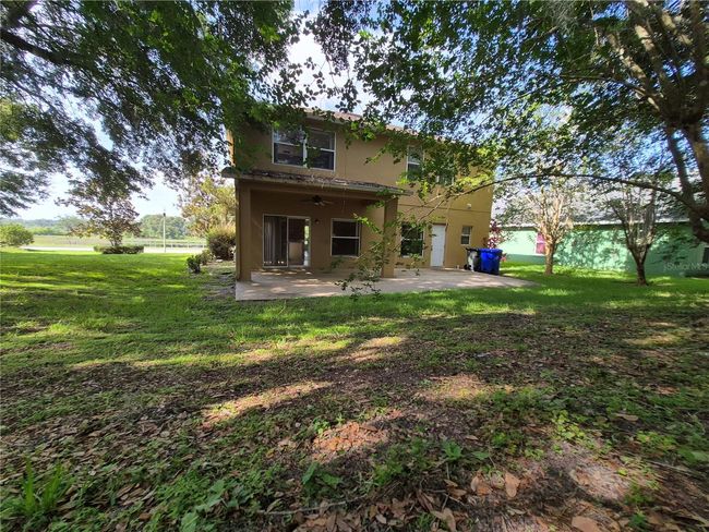 rear of home facing water view | Image 32