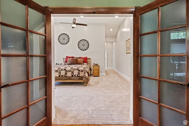 Carpeted bedroom with baseboards and french doors | Image 31