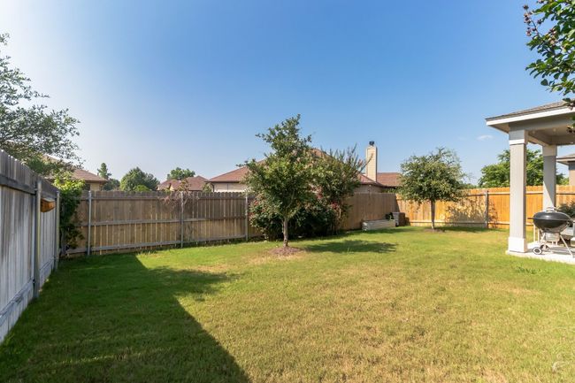 View of fenced backyard | Image 30