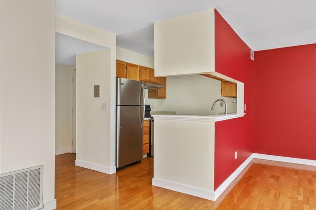 View of dining room, kitchen and entry | Image 10