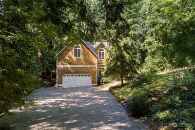 Enjoy the privacy of a forested lot, coupled with a convenient location. | Image 2