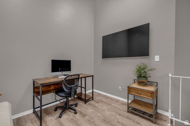 Office space featuring baseboards and wood finished floors | Image 16