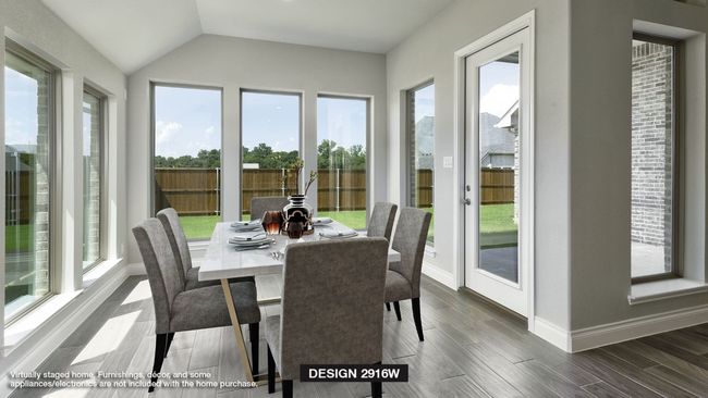 Sunroom featuring vaulted ceiling and a healthy amount of sunlight | Image 6