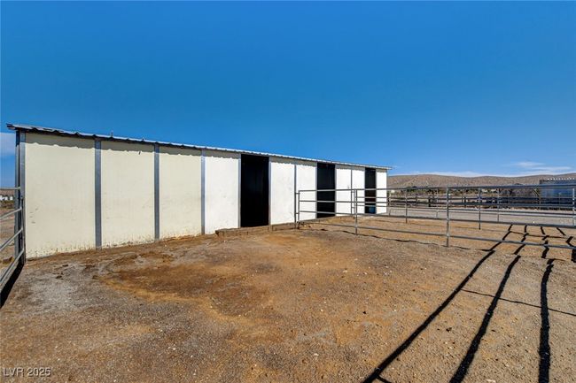 View of outbuilding featuring an exterior structure and a mountain view | Image 47