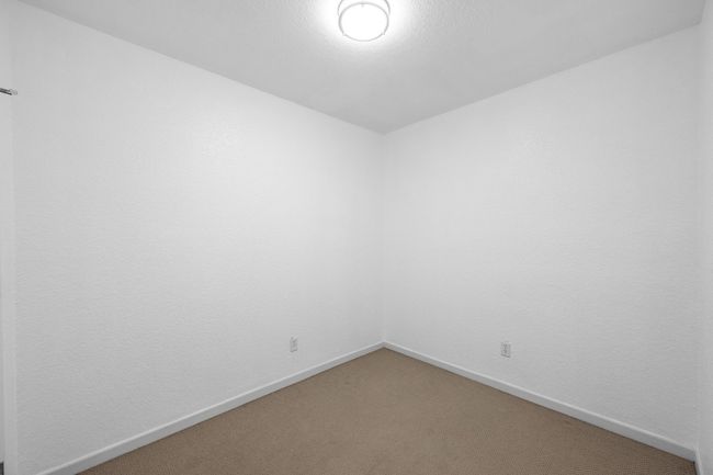 Spare room featuring light colored carpet and baseboards | Image 11