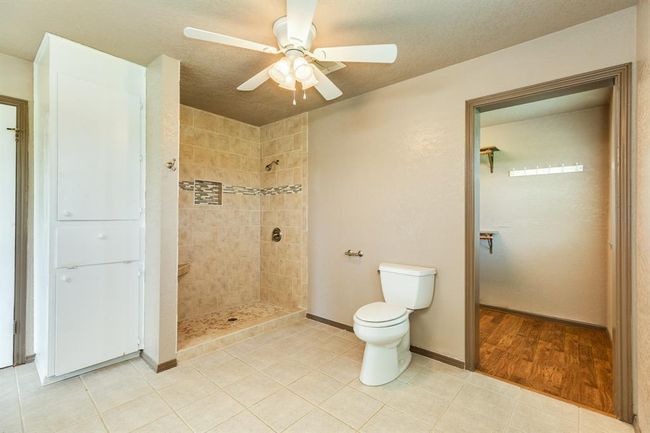 The door to the right of the photo is the entrance to the massive walk-in closet. Bathroom is approximately 11'7" x 11'2". Buyer to verify all room measurements. | Image 40