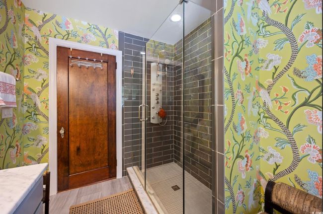 Full bath with vanity, a shower stall, and wallpapered walls | Image 16
