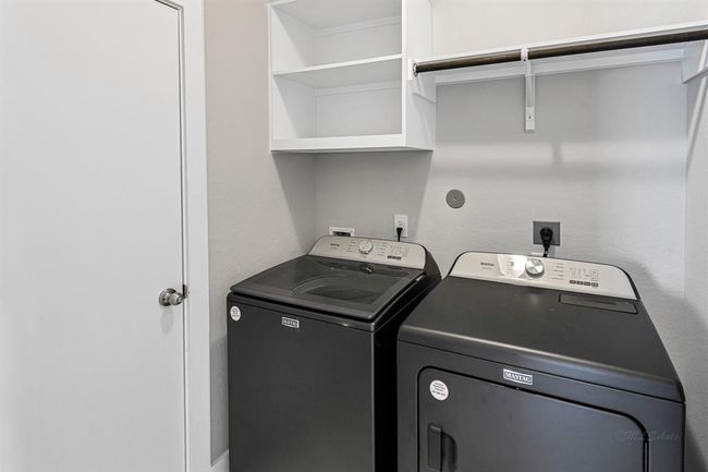 Laundry room with access to attached garage. Washer and dryer convey. | Image 27