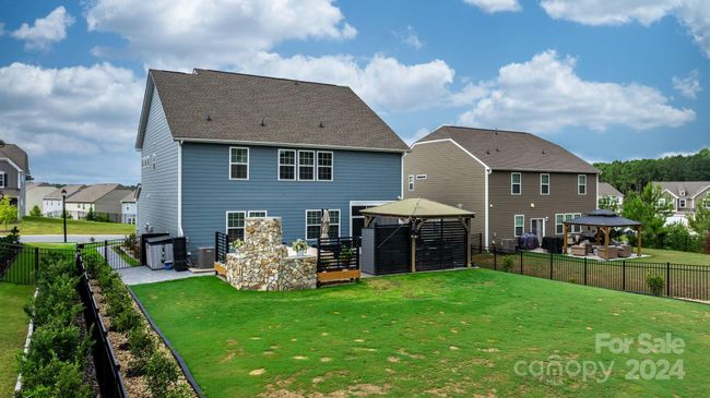 Back view of home. Trash cabinet will remain. | Image 40