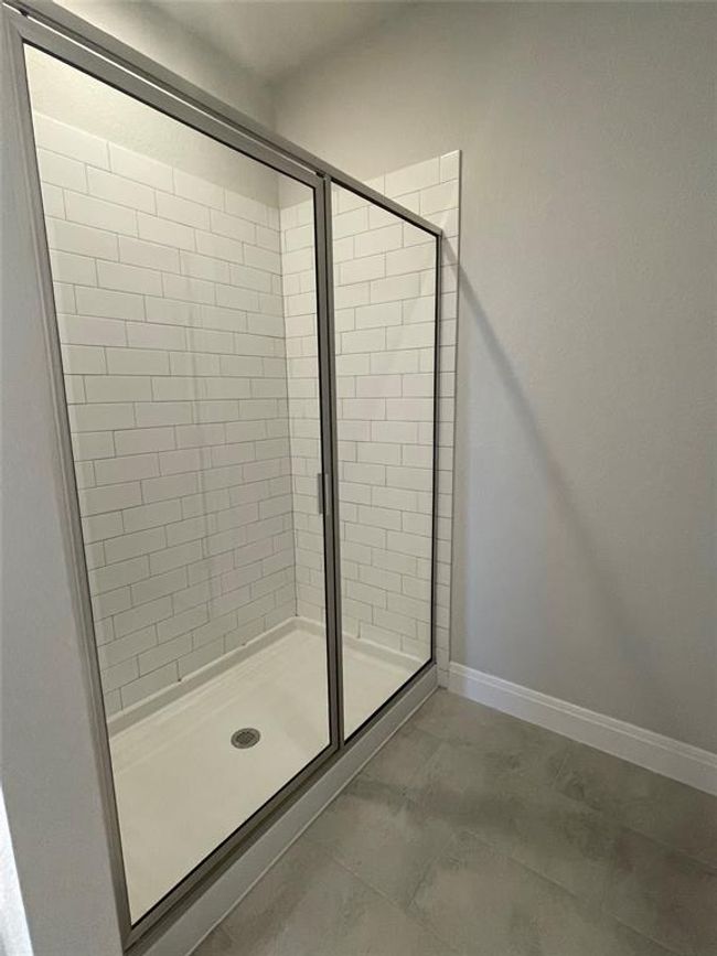 Full bath with a shower stall and baseboards | Image 11