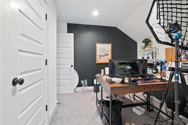 Office space with carpet floors, vaulted ceiling, and baseboards | Image 39