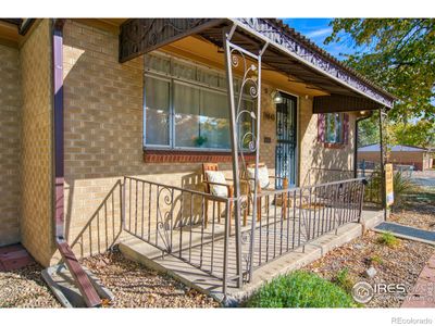 Covered front porch faces south | Image 2