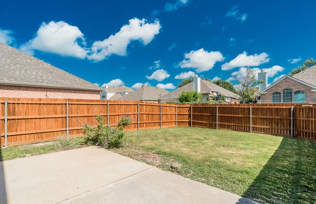 Freshly Stained Fence Surrounds Large Back Yard. | Image 35