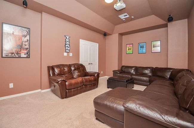 Another view of media showing double doors to game room. | Image 36