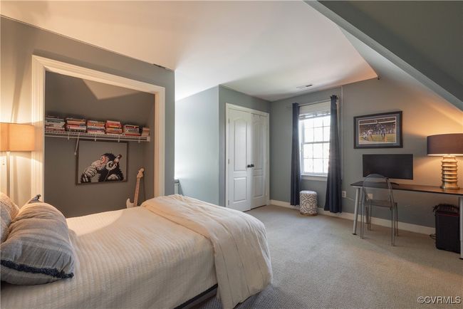 Bedroom with visible vents, baseboards, and carpet | Image 25