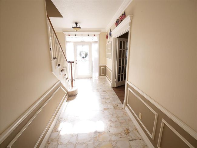 A view of the entry way from the kitchen | Image 7