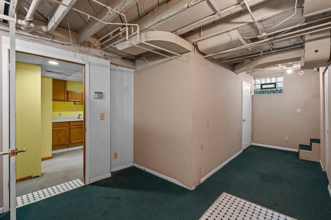 Additional finished space in the lower level offers flexibility for extra storage. | Image 13