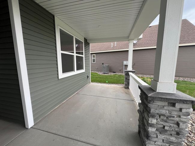 Photo is of the actual home. A spacious front porch to welcome guests and enjoy the outdoors! | Image 16
