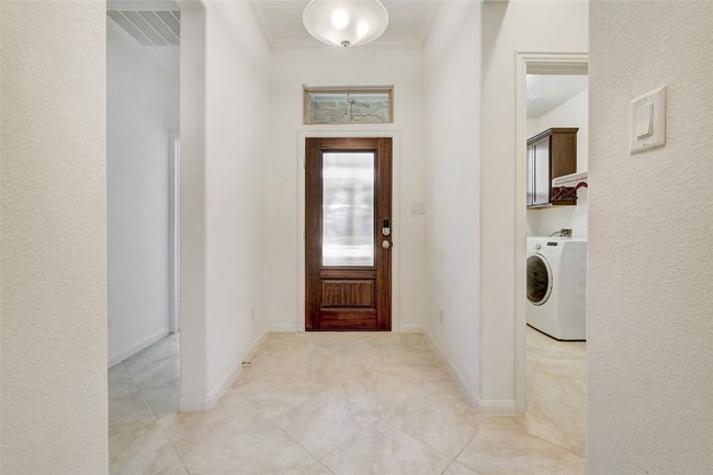 1st bedroom by front and garage entry | Image 13