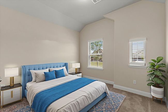 Bedroom featuring carpet floors and lofted ceiling | Image 23