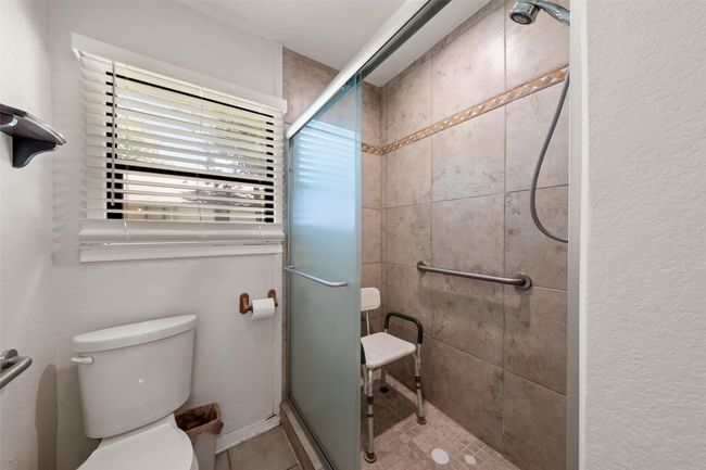 Bathroom with a stall shower | Image 10