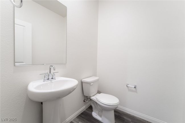 Bathroom featuring wood finished floors and baseboards | Image 21
