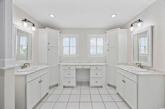 Full bathroom featuring two vanities, recessed lighting, and tile patterned flooring | Image 22